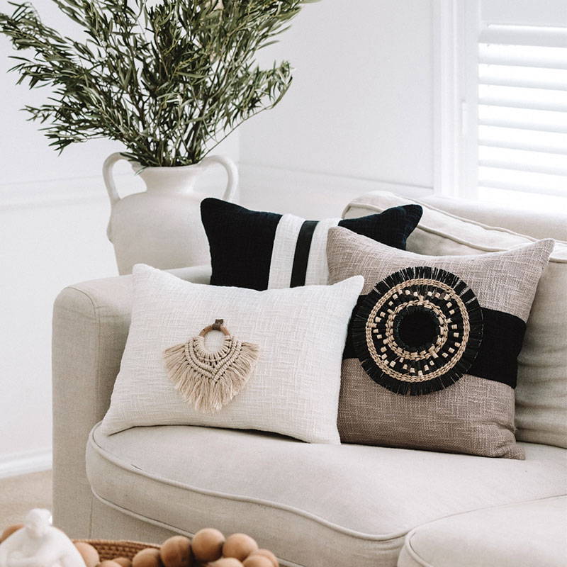 Brown cushion featuring a black and natural seagrass Cushion Accessory for a modern cushion in a modern home