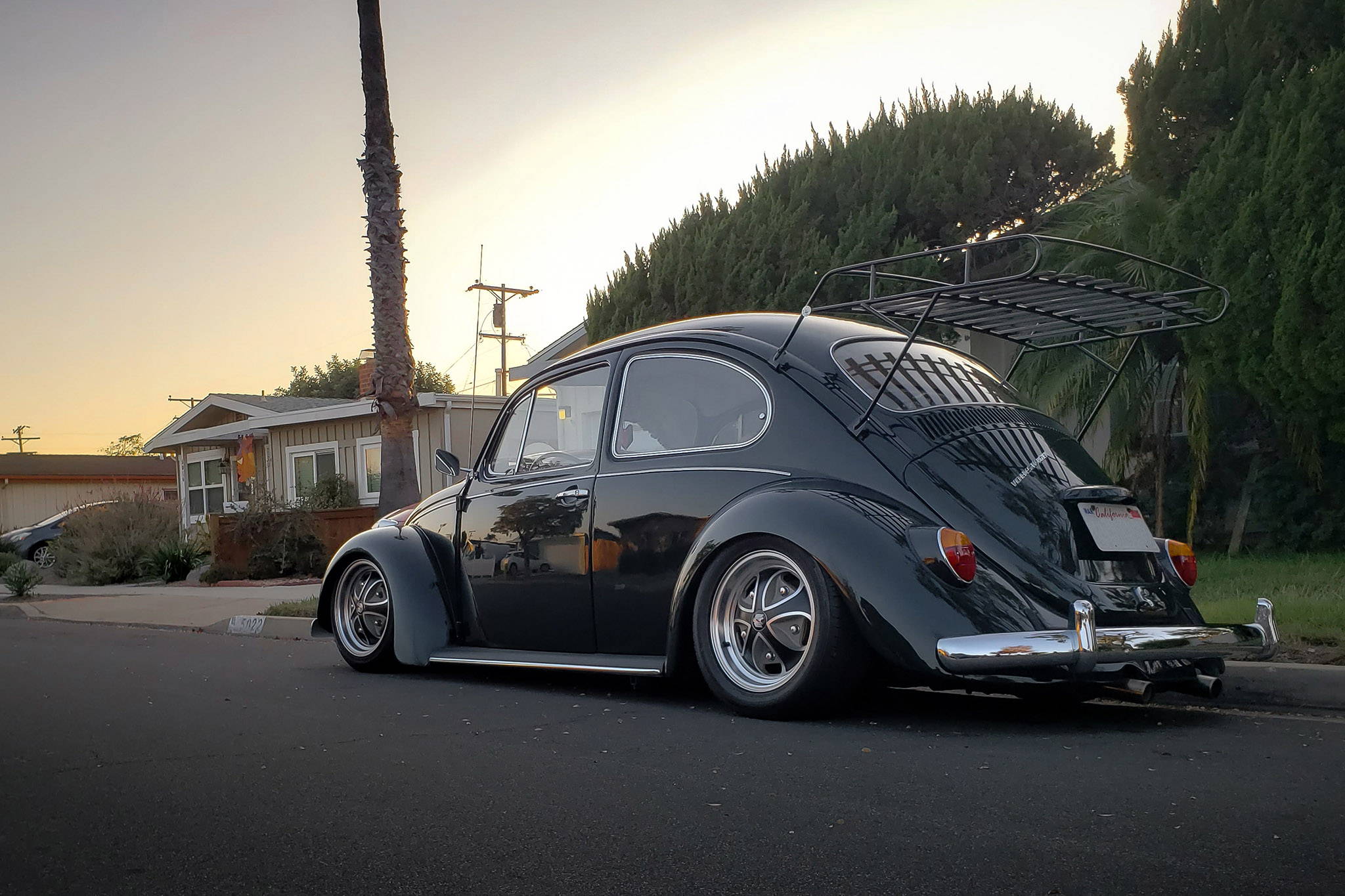 black volkswagen beetle on black machined with gray klassik rader falcon wheels