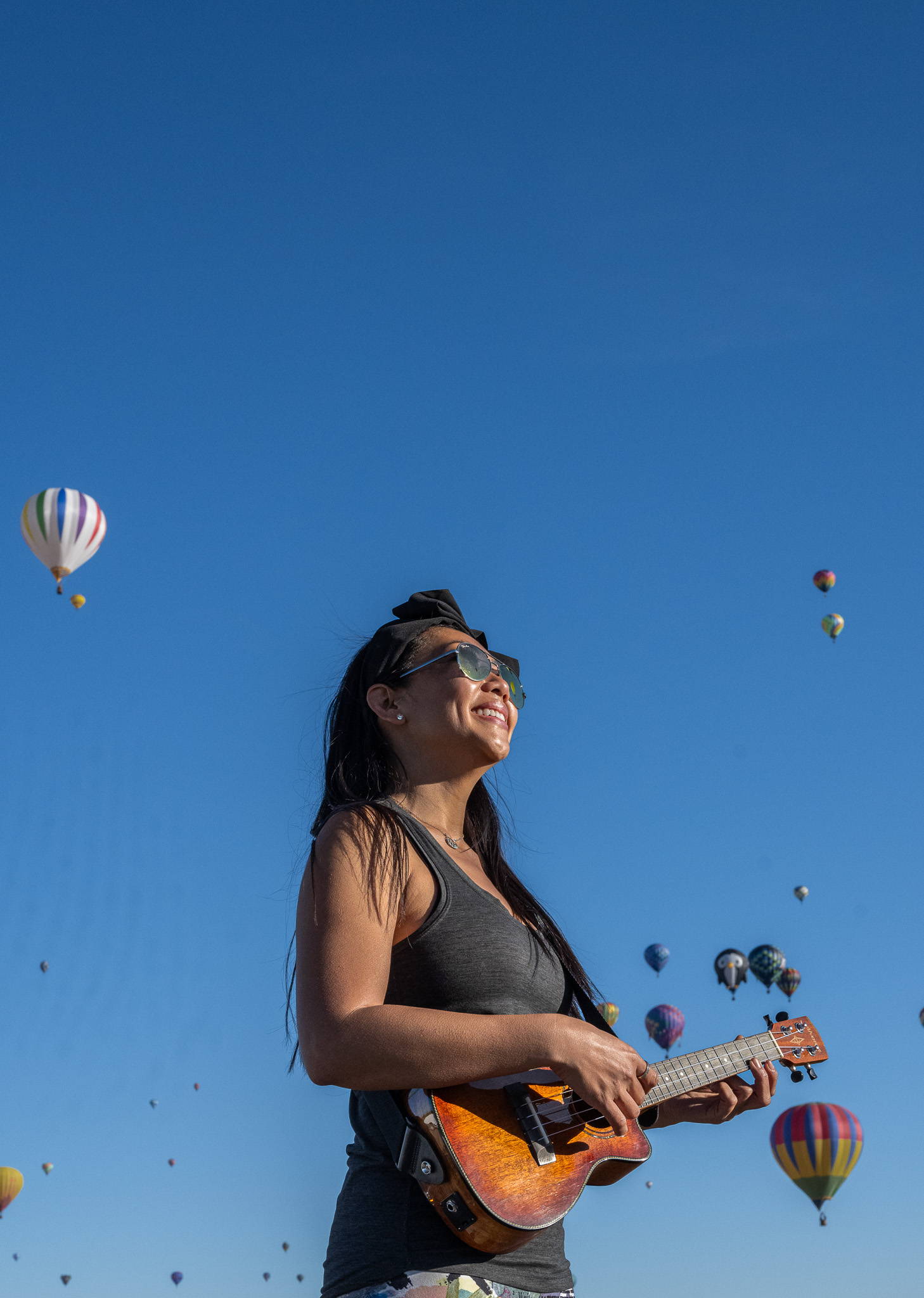 Kayden Phan strumming a uke at the Albuquerque Balloon Fiesta