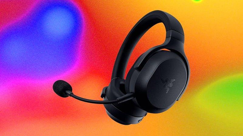 Black headphones with extended microphone sticking out of one ear cushion