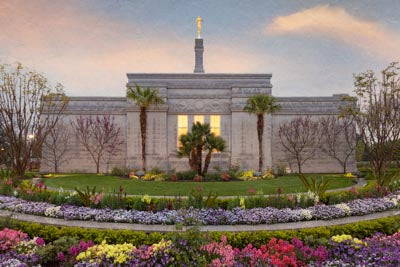 Fresno Temple  encircled by full flowerbeds.