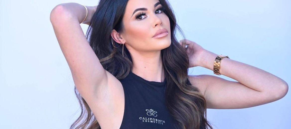 female model wearing a California Cosmetics tank top