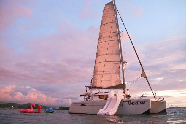 Three girls sitting on Udream Yacht Kota Kinabalu