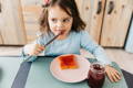 Toddler eating in the morning.