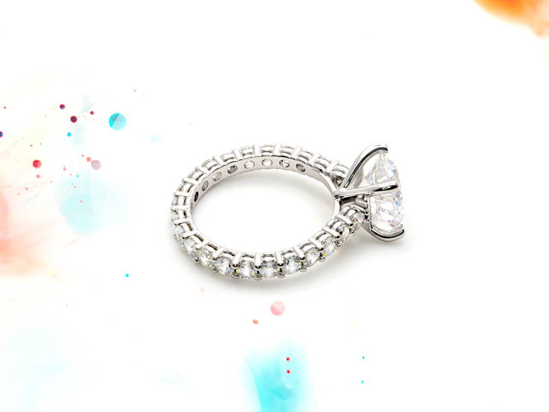 Halo ring encircled by small diamonds with a large main diamond mounted on four claws