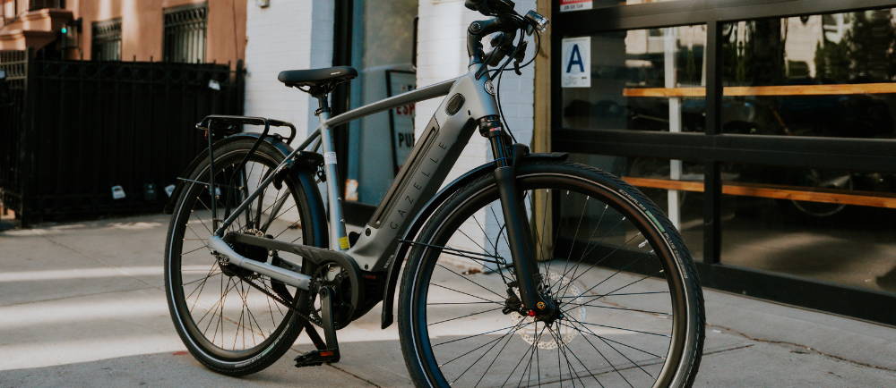 A silver Gazelle Ultimate C380+ electric commuter bike