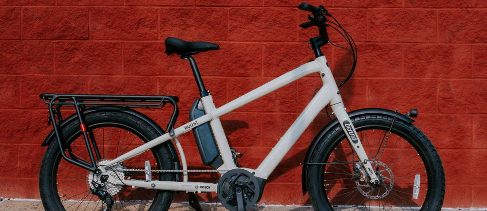 a white Benno Boost electric cargo bike