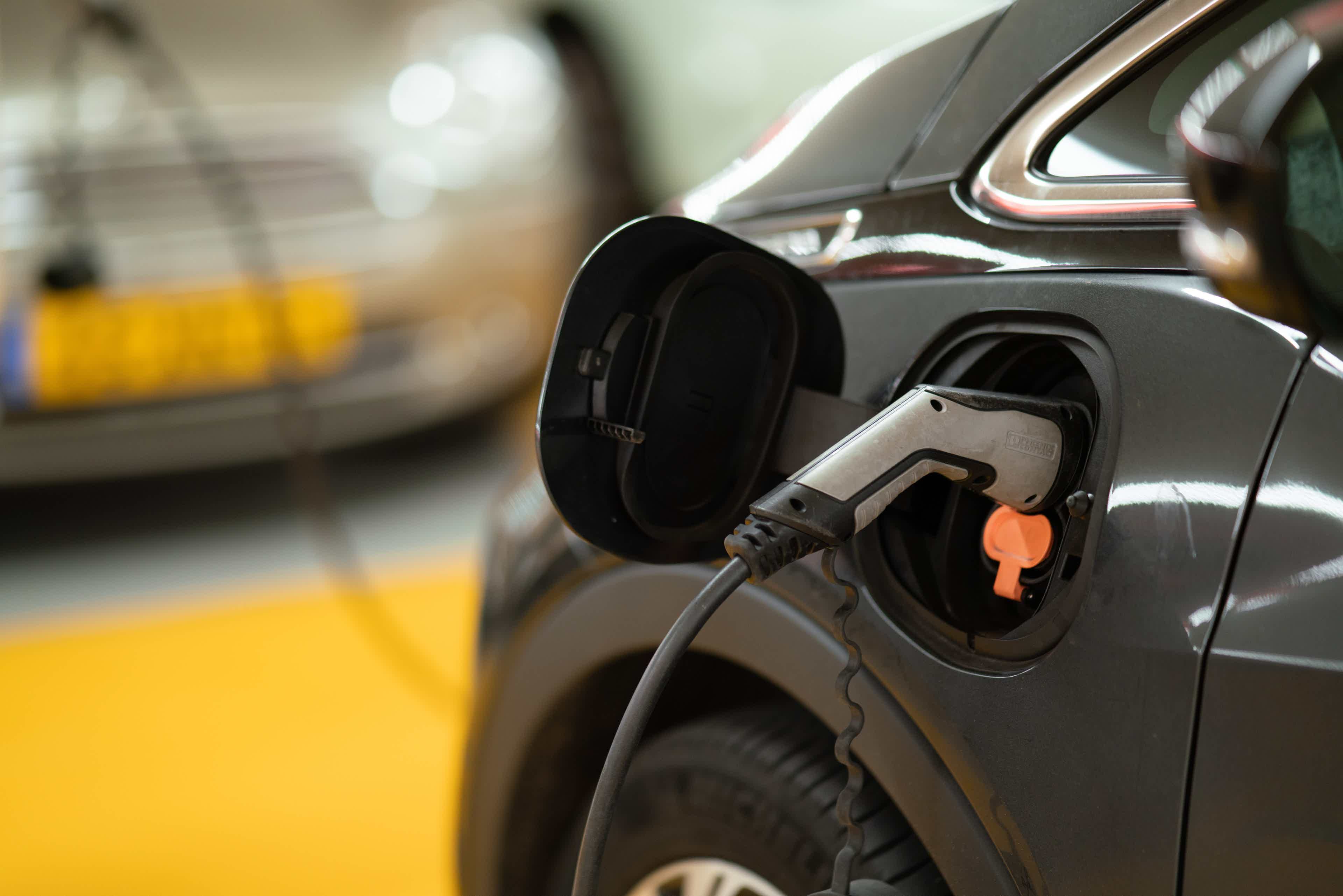 An electric car plugged into a charging station