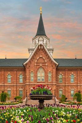 Provo City Center Temple with a fountain full of tulips.