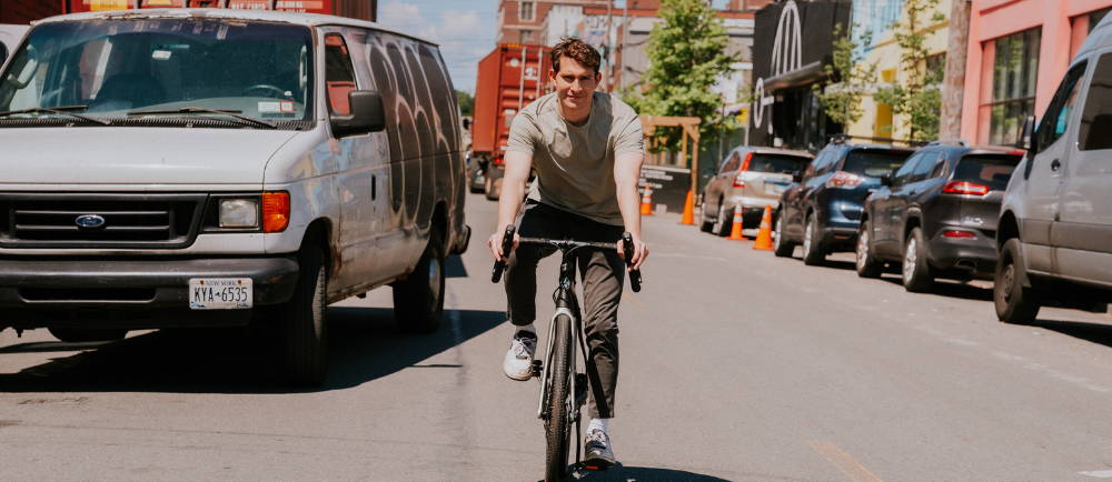 Man on Bianchi E-Impulso electric gravel bike on New York street