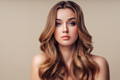 oung beautiful woman with long gold brown wavy hair