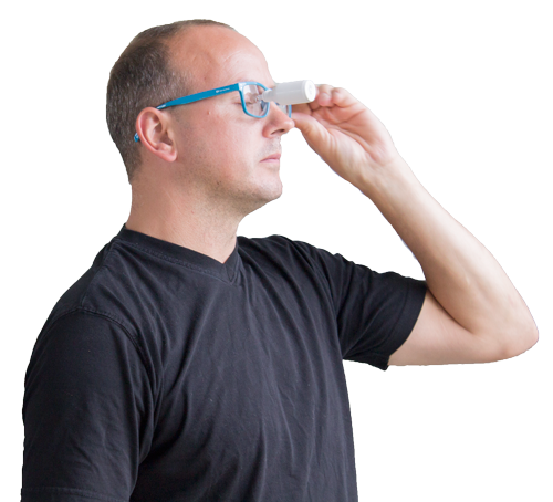 How the eye drop helper works - Step 2: Wear. Put the glasses on with the eye drop bottle, pipette or single use vial attached in one of the three holes. The bottle, pipette or vial will not fall out when picking up the glasses.