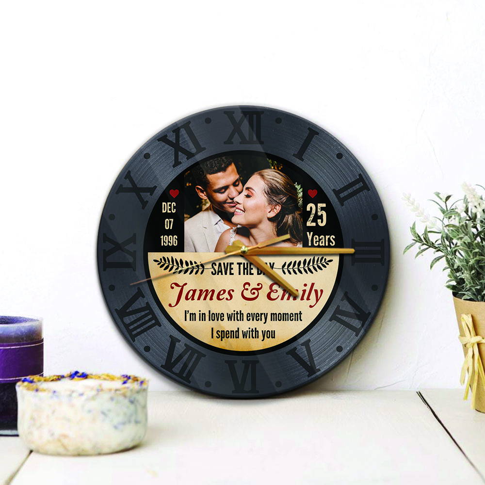 a circle wall clock print photo, name, and date on a black color background is the most perfect 25th-anniversary gift