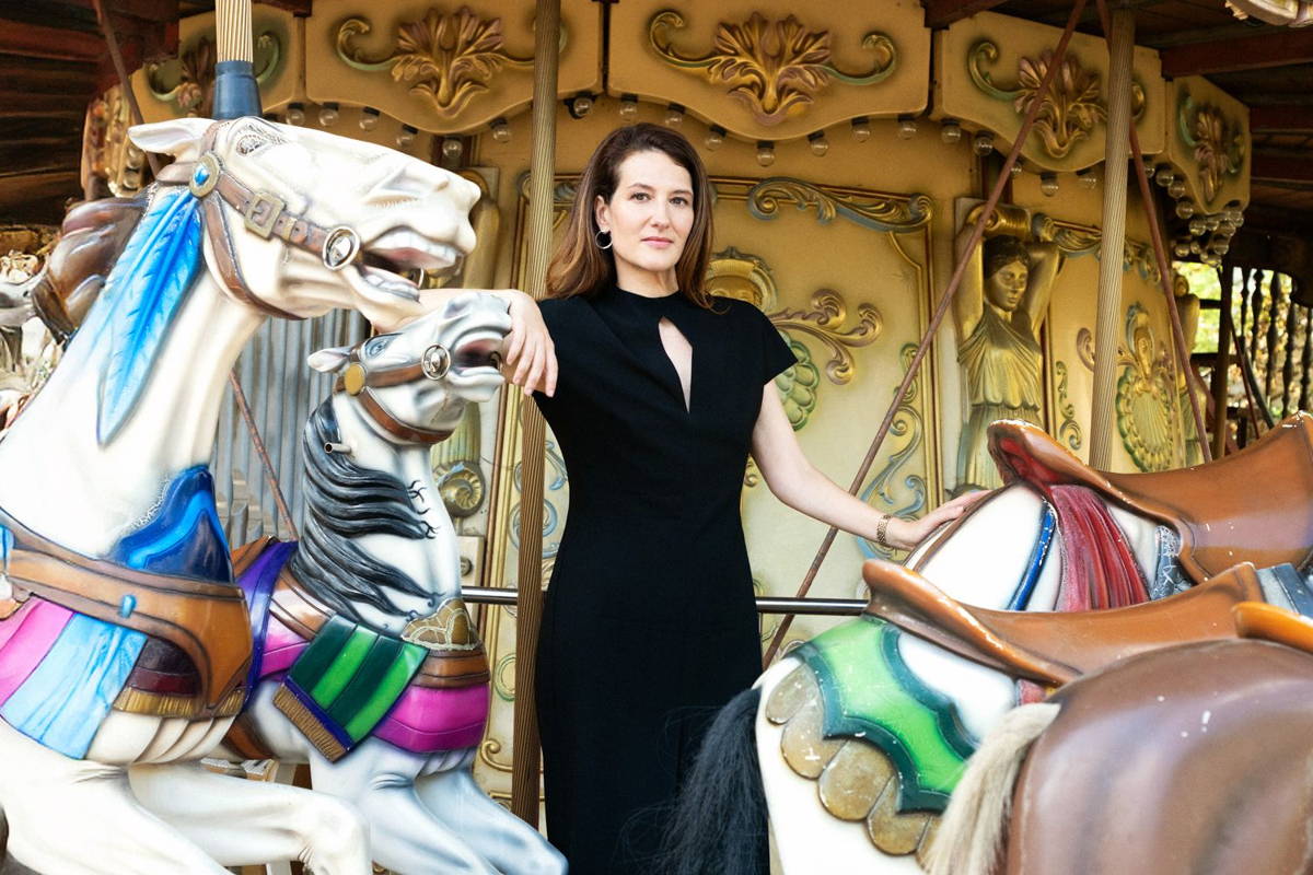 Image may contain: Scott Allie, Adult, Person, Face, Head, Photography, Portrait, Amusement Park, Carousel, Play, and Animal