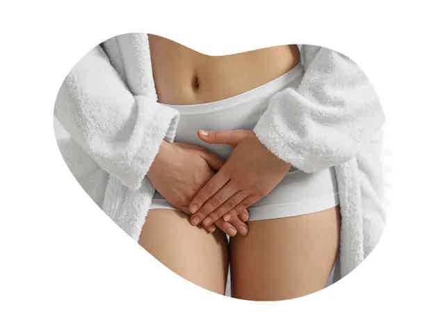 postnatal care pregnant mother with baby shoes