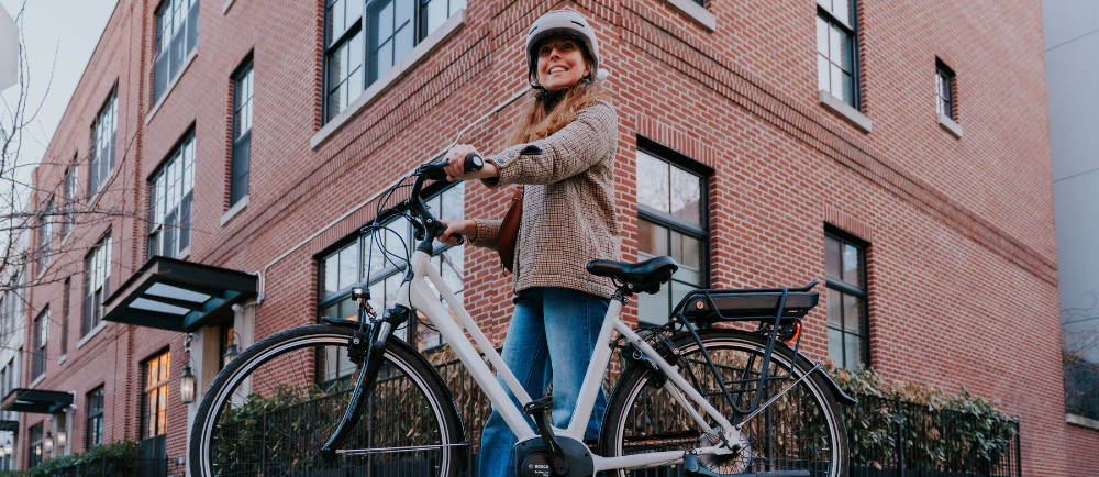 Woman with Gazelle city electric bike in New York City