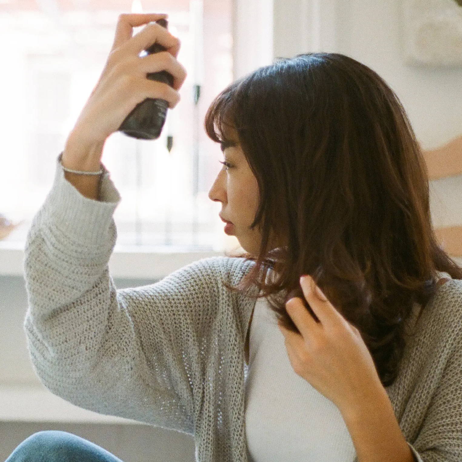 woman using Davines OI Oil