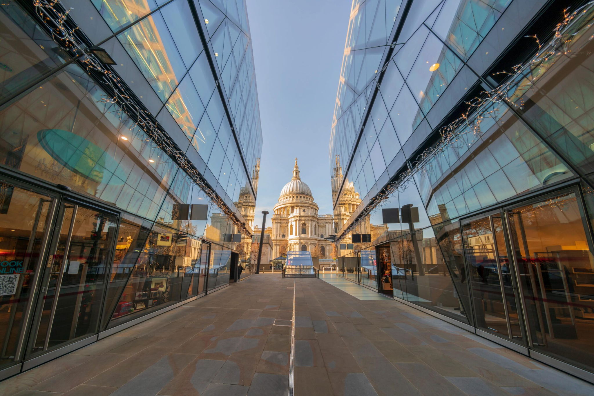 A government building with a cathedral prominently visible in the background, showcasing architectural grandeur.