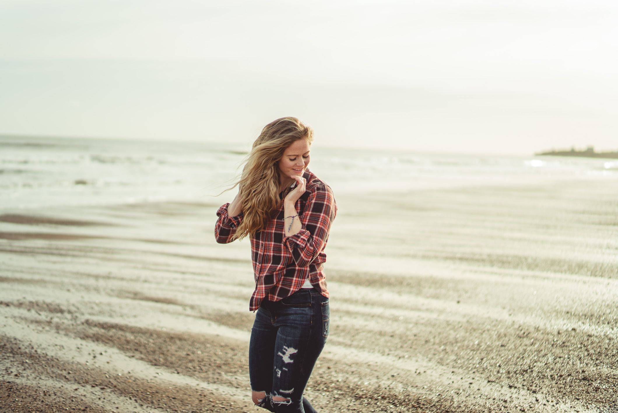 Image of a happy woman with a wavy hair