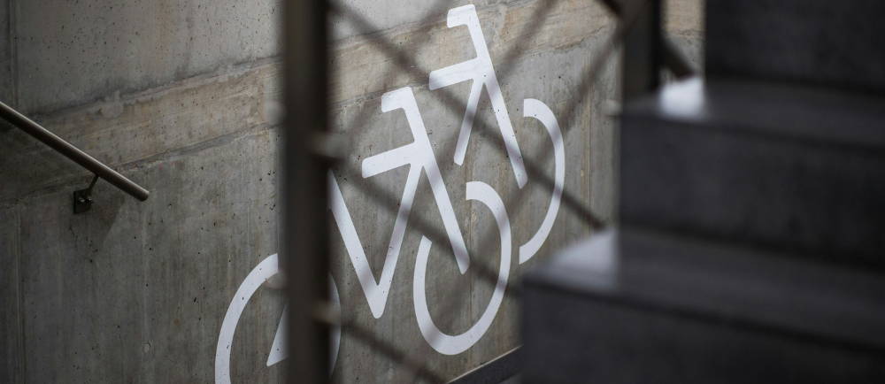 Bike graphic on wall in concrete staircase