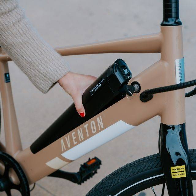 someone removing an e-bike battery
