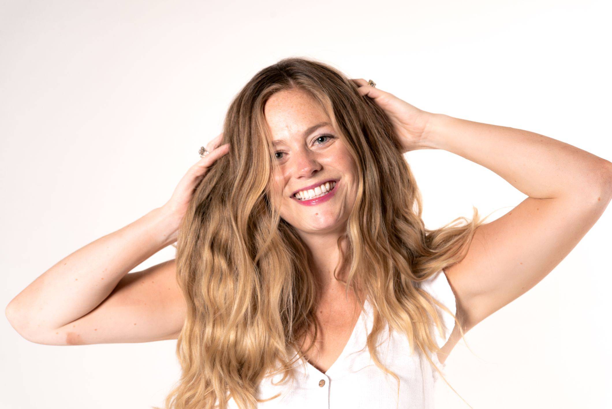 Image of a happy woman with a wavy hair