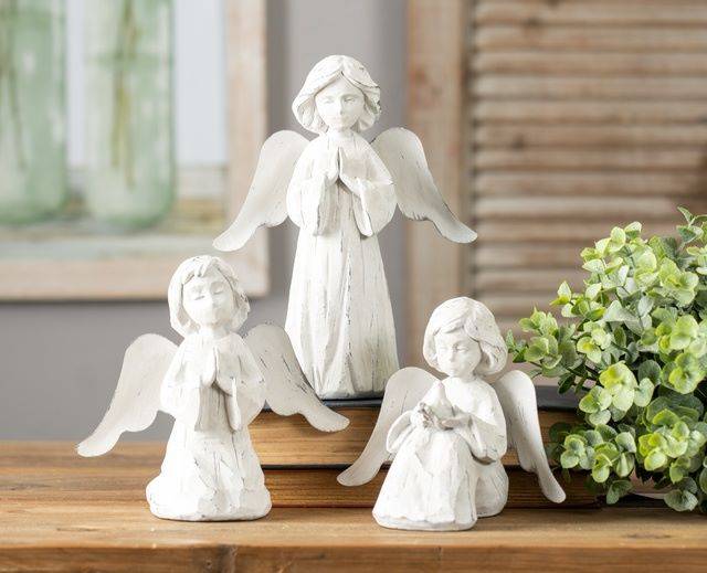 small resin garden angels with hands in prayer