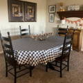 white and black checkered tablecloth on an oval table