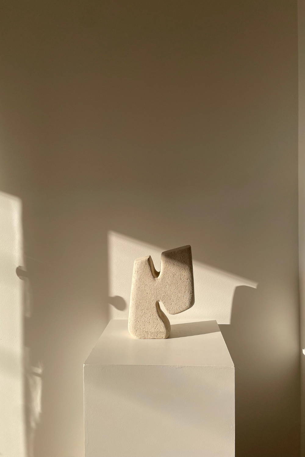 Gilani Collection Sculpture Art by Evelyn Michaelides - Hand-carved, organic-shaped limestone sculpture art.