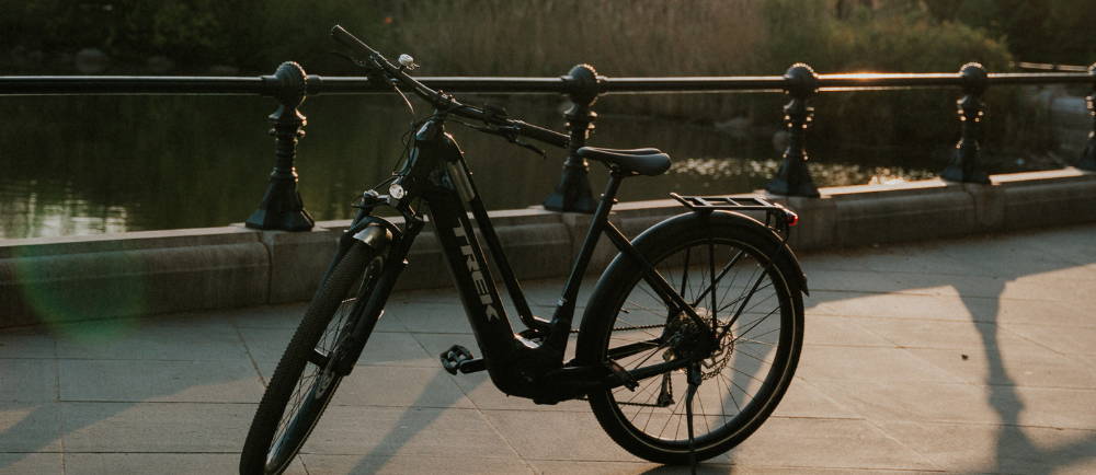 a black Trek Allant step through electric bike
