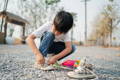 Boy tying his shoes. 