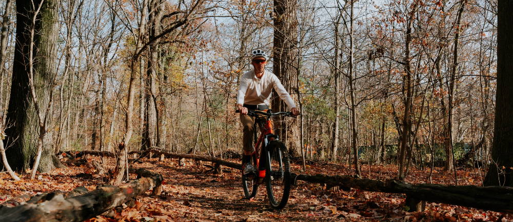 Rider on electric mountain bike on trail