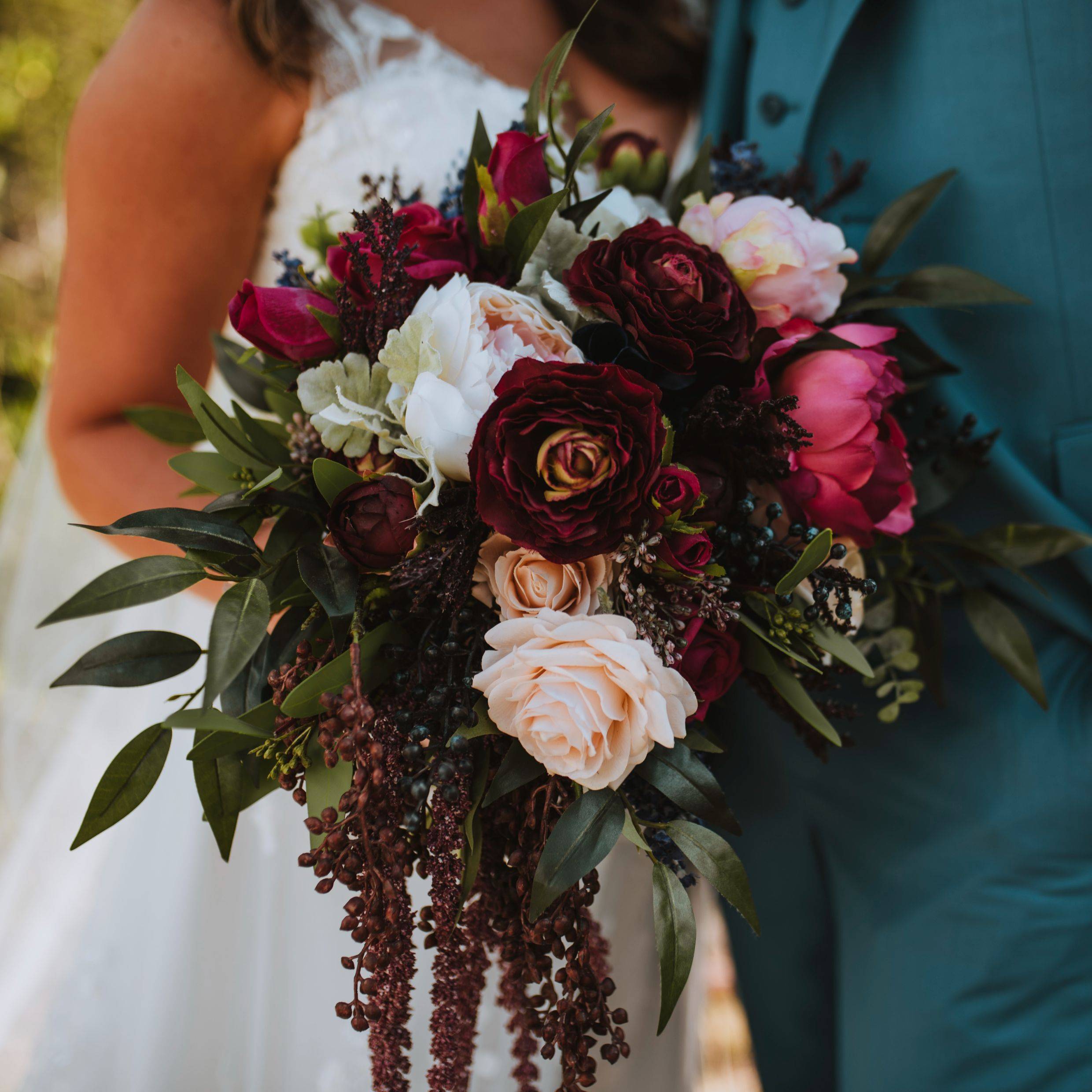 Jewel tone cascading bouquet for colorado mountain wedding 