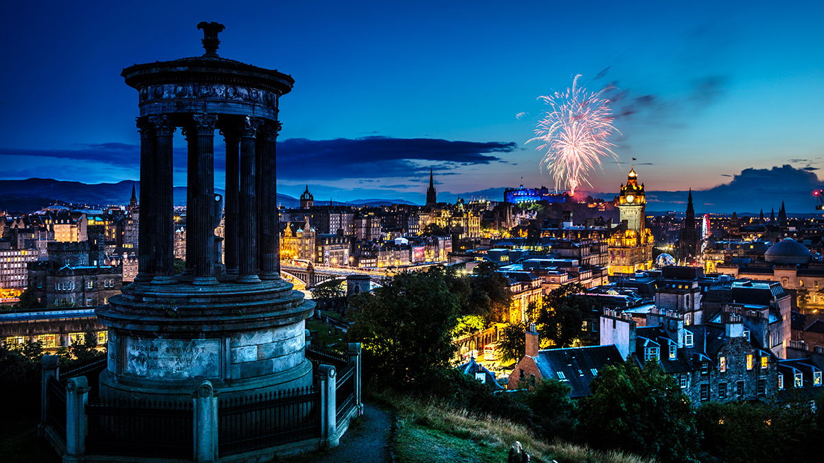 A night time view of Edinburgh with fireworks.