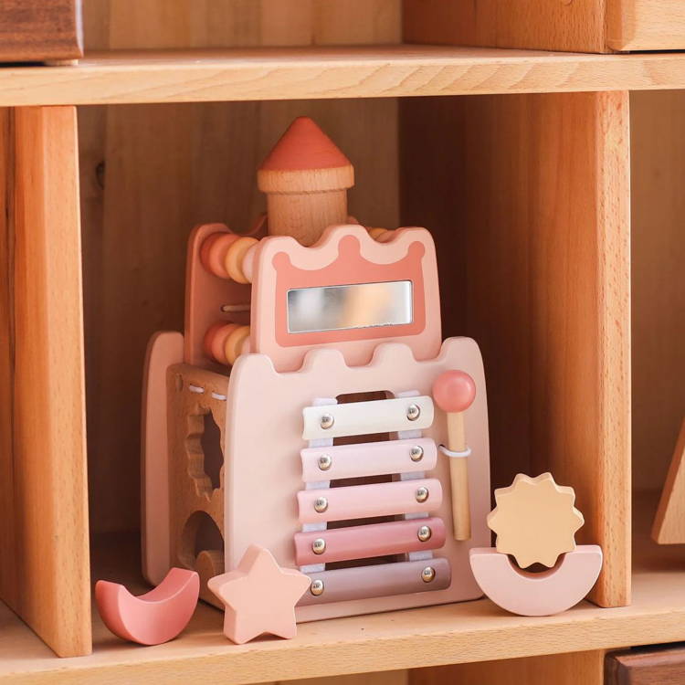 Montessori Learning Castle on a wooden shelf.