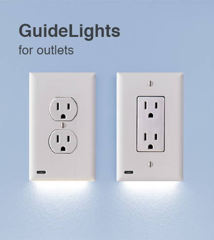 Two outlet light covers on a light blue wall
