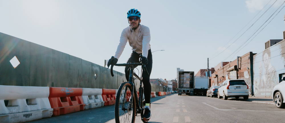 a man riding a Cannondale Topstone Neo electric road bike in a city
