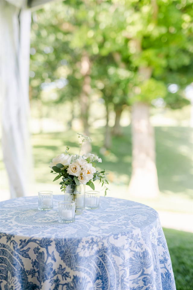 blue and white linen cocktail table with white flowers