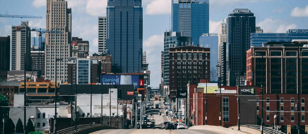 Photo by <a href="https://unsplash.com/@cabennetts?utm_source=unsplash&utm_medium=referral&utm_content=creditCopyText">Caleb Bennetts</a> on <a href="https://unsplash.com/photos/a-city-street-with-tall-buildings-nq7wDDpi52U?utm_source=unsplash&utm_medium=referral&utm_content=creditCopyText">Unsplash</a>