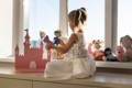 Kid playing with toys.