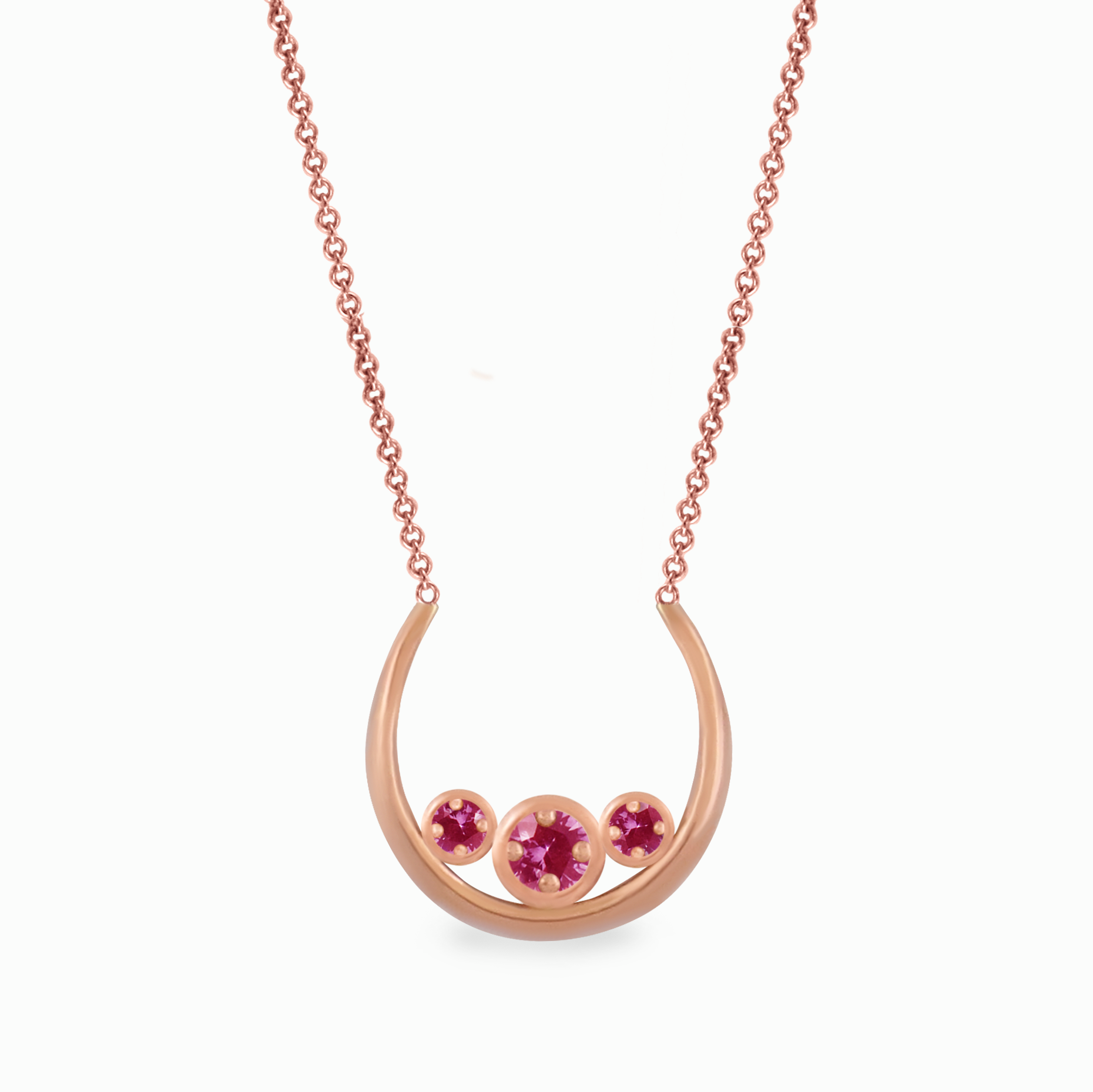 Pink gold pendant with pink saffires subtly reminiscent of a breast. Designed for breast cancer research.