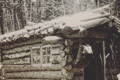 an old log cabin with a pack hanging next to the open door in black and white