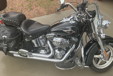 2009 HARLEY-DAVIDSON FLSTC HERITAGE SOFTAIL CLASSIC (BLACK) motorcycle for rent near BOX ELDER, SD
