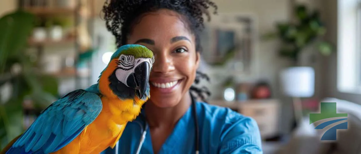 A travel nurse smiling during a telehealth call with a pet parrot.