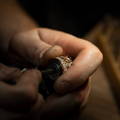 Jeweler making a custom engagement ring