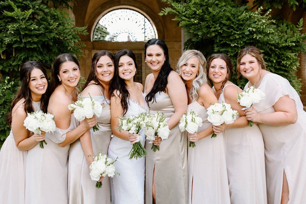 Bride with her bridesmaids in champagne dresses