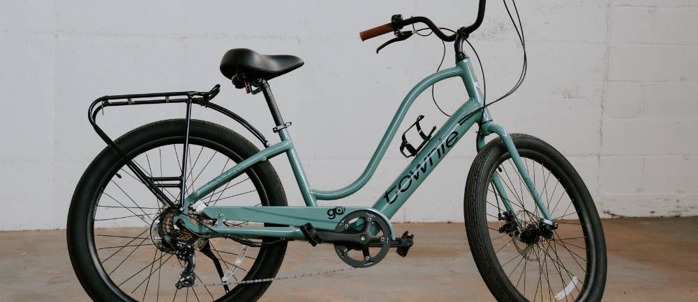 a teal Electra Townie electric city bike