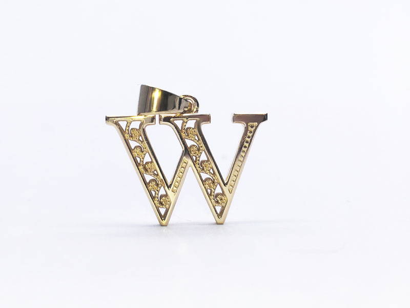 Yellow gold pendant representing the letter W with filigree motifs