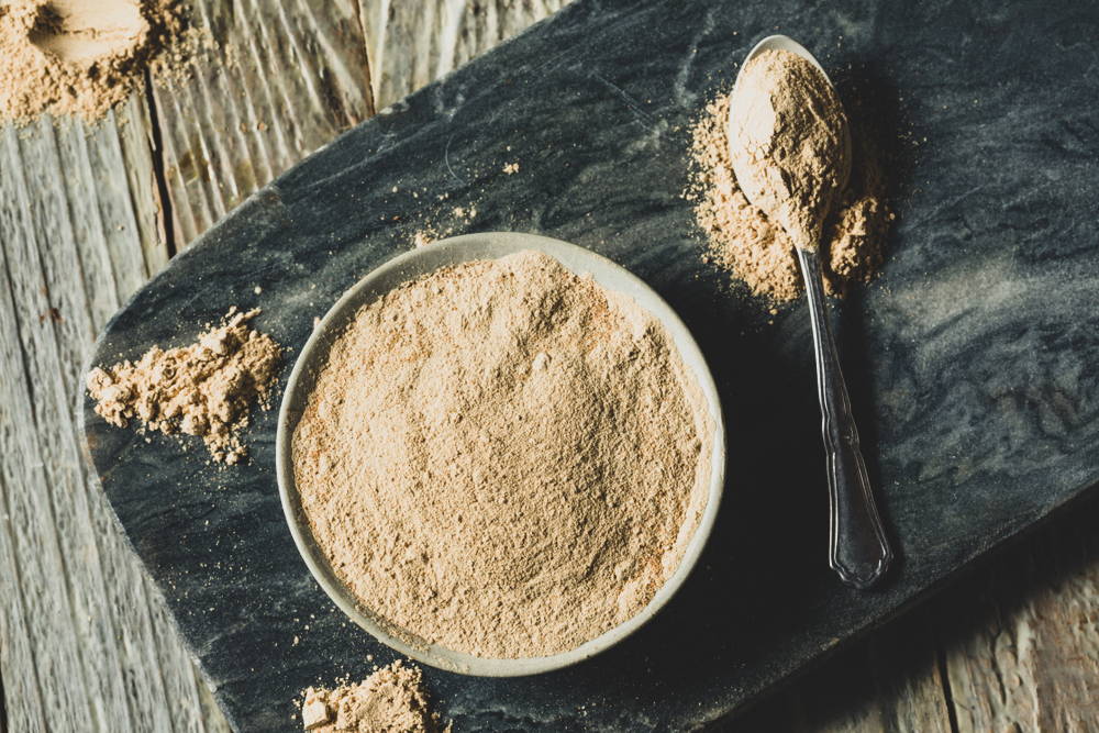 Maca root powder on table