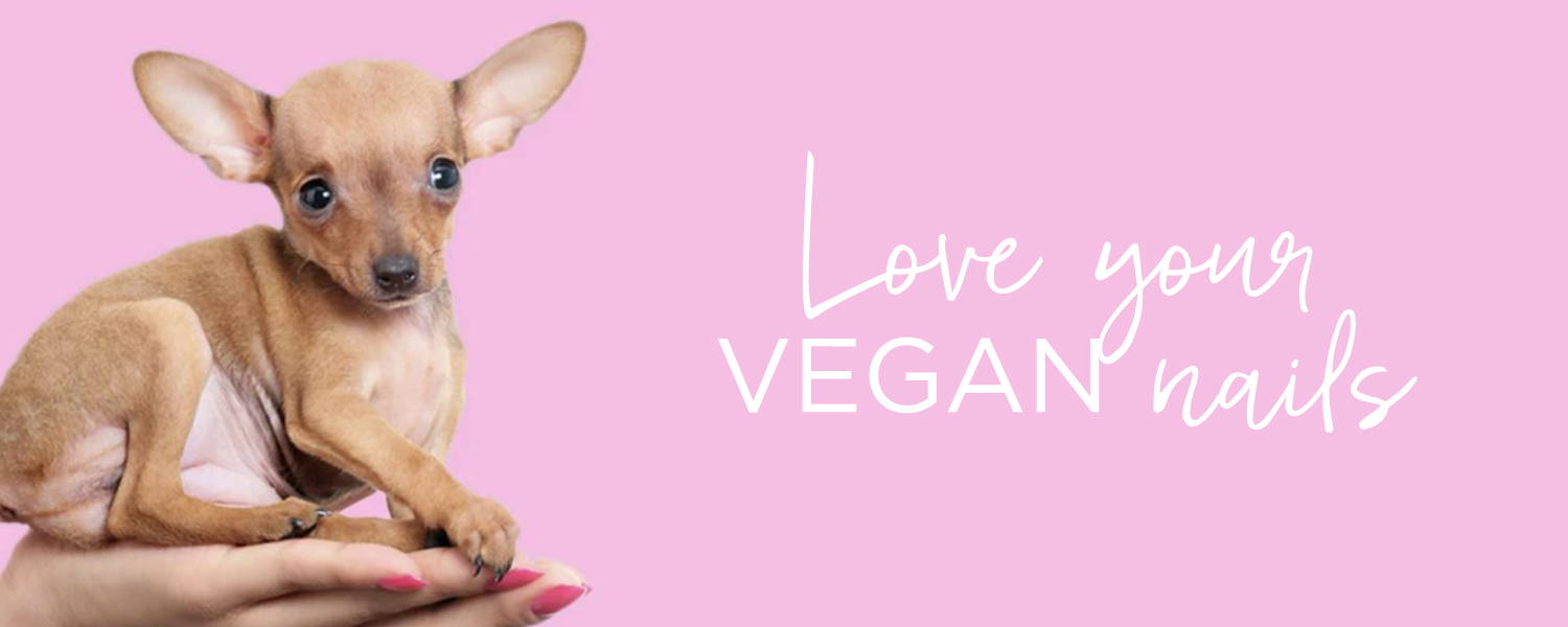 ORLY manicured hand holding cute puppy with the words 'love your vegan nails'